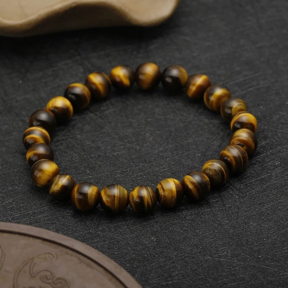 PULSERA ABUNDANCIA DORADA (Ojo de tigre 8 mm)